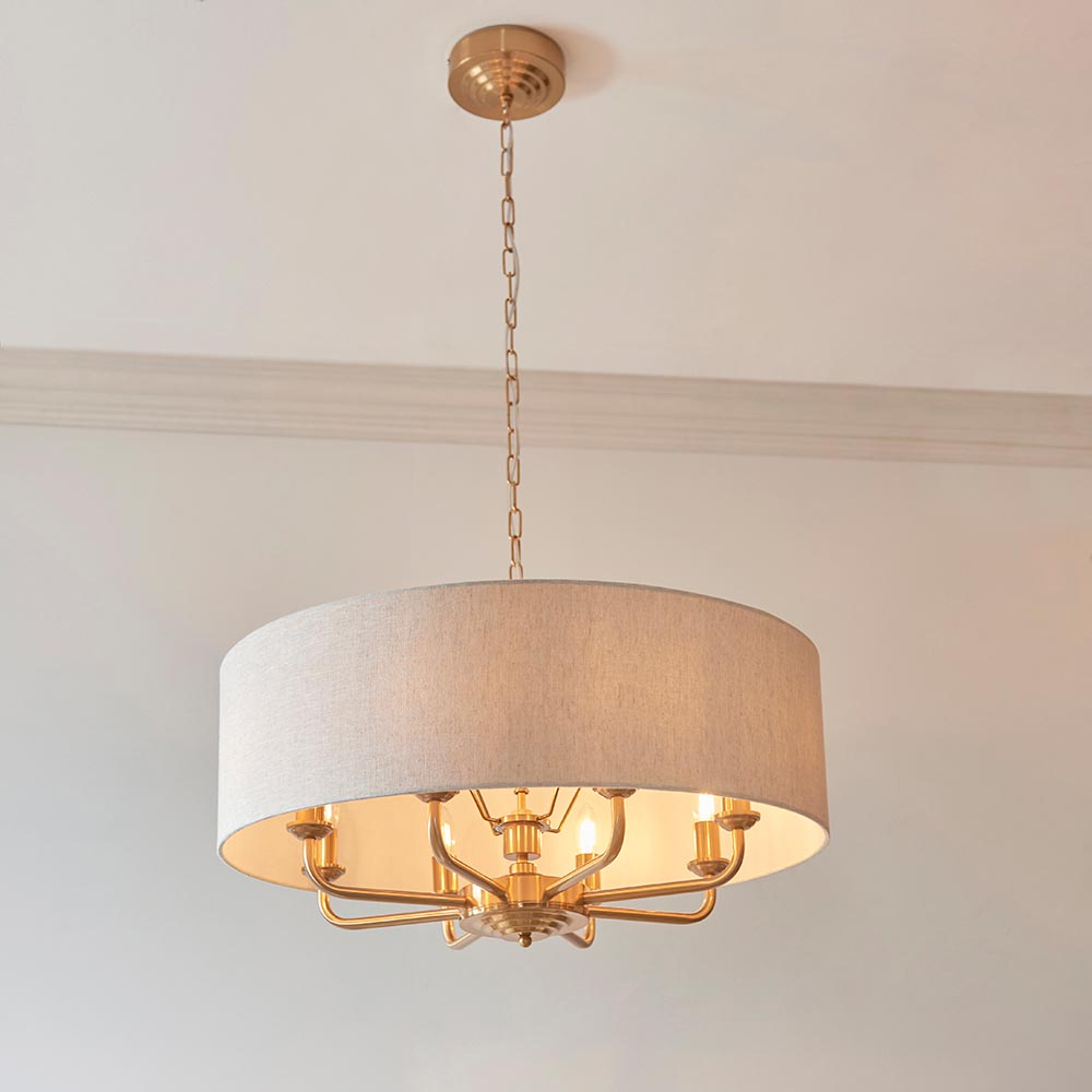 Read more about Hixson 8 light natural fabric pendant ceiling light in brass