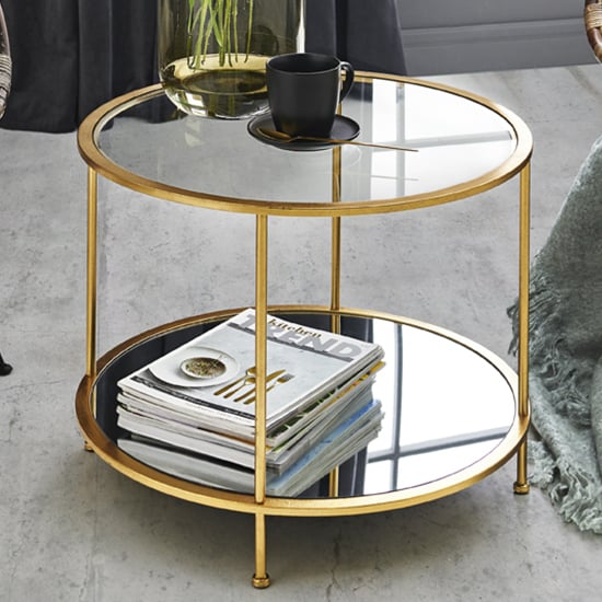 Photo of Inman round mirrored glass coffee table in gold with undershelf