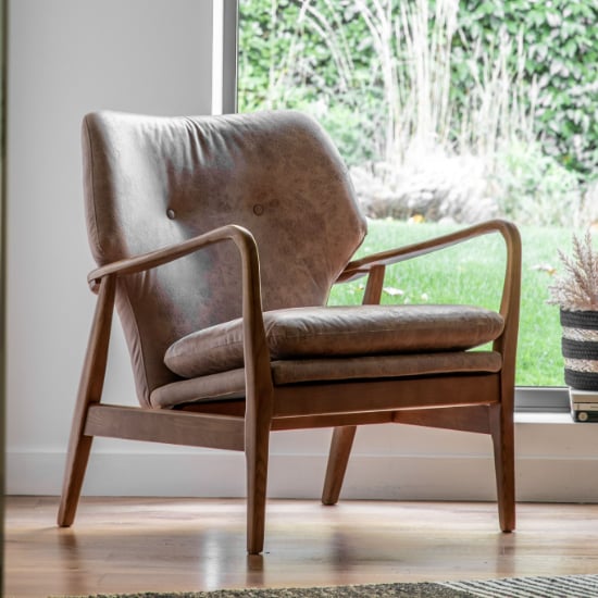 Read more about Jenson leather armchair with wooden legs in brown