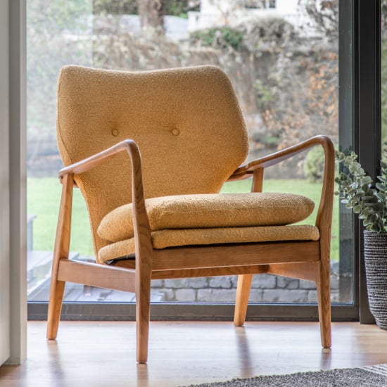 Read more about Jenson fabric armchair with wooden legs in ochre