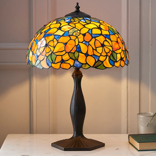 Photo of Josette medium tiffany glass table lamp in dark bronze