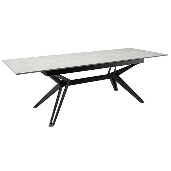 Photo of Kara stone extending dining table with black metal base