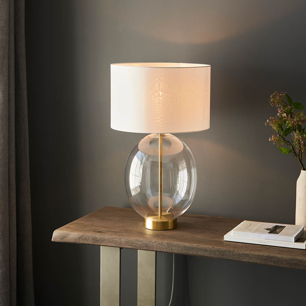 Read more about Katonah oval clear glass table lamp in white and brass