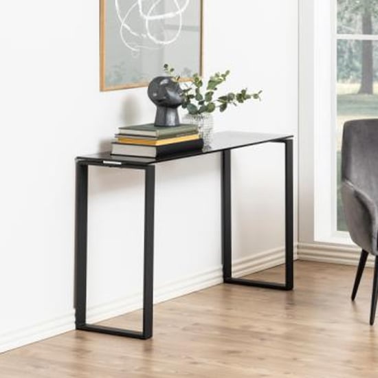 Product photograph of Kennesaw Smoked Glass Console Table With Black Frame from Furniture in Fashion