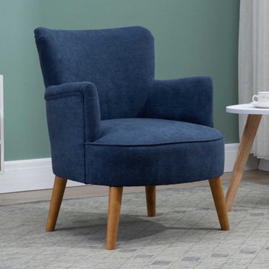 Read more about Krabi fabric bedroom chair in midnight blue with wood legs
