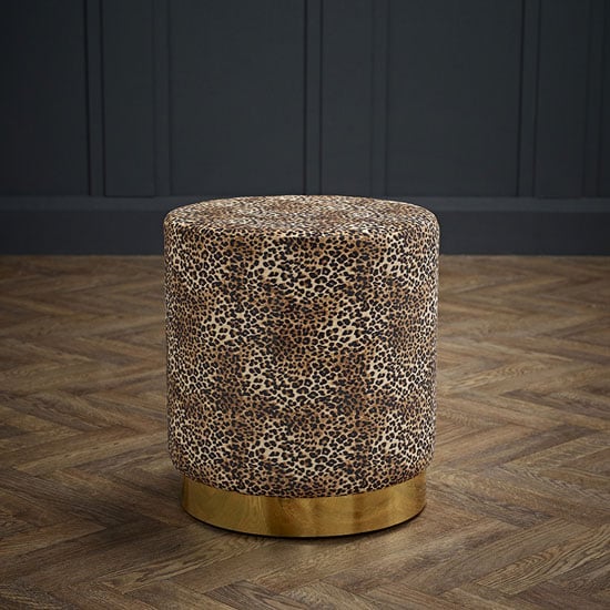 Read more about Lewes round velvet pouffe with gold base in leopard print