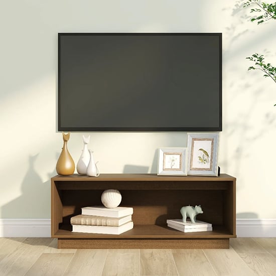 Read more about Lazaro solid pinewood tv stand with undershelf in honey brown