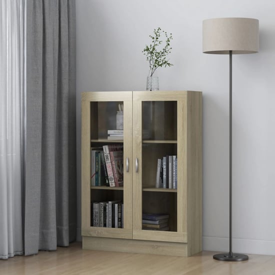 Product photograph of Libet Wooden Display Cabinet In With 2 Doors In Sonoma Oak from Furniture in Fashion