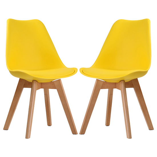 Photo of Livre yellow plastic dining chairs with wooden legs in pair