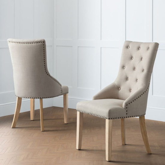 Photo of Landen button back oatmeal linen dining chairs in pair