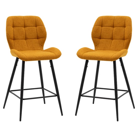 Read more about Macerata saffron fabric bar stools with black legs in pair