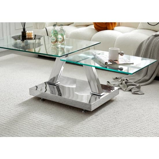 Photo of Magic wings swivel clear glass coffee table with steel base