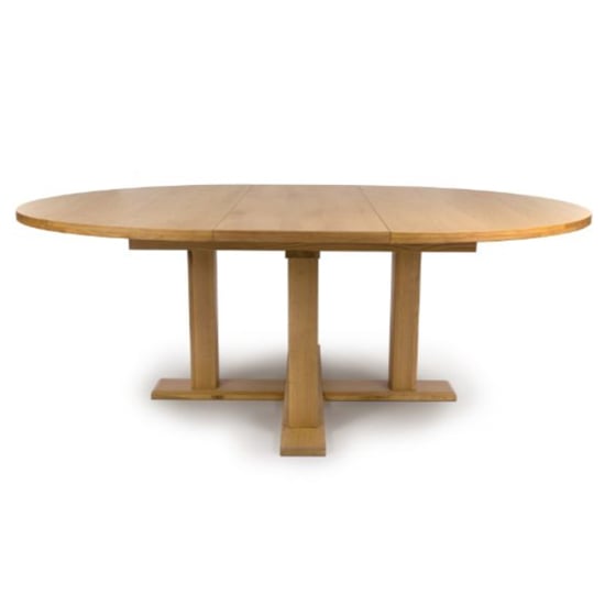 Photo of Magna round extending wooden dining table in oak