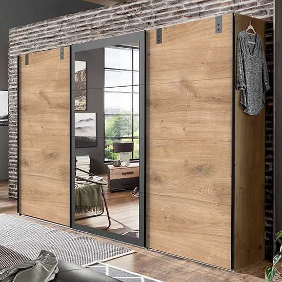 Read more about Malmo wide mirrored sliding wardrobe in planked oak and graphite