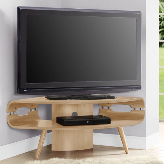 Photo of Marin corner wooden tv stand in oak with spindle shape legs