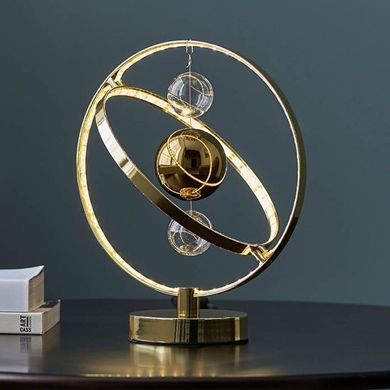 Read more about Marion clear glass suspended spheres table lamp in gold