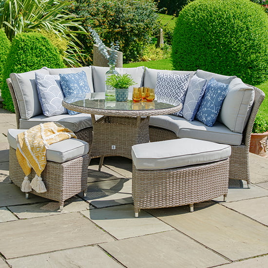 Photo of Meltan outdoor modular curved lounge dining set in sand