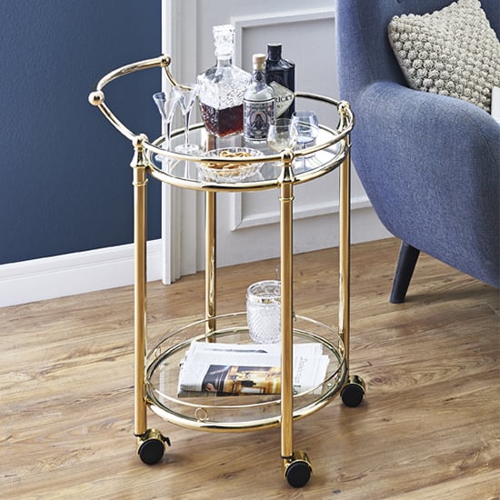 Read more about Merksem round clear glass shelves serving trolley in brass