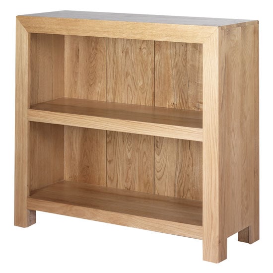 Photo of Modals wooden low bookcase in light solid oak