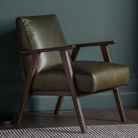 Read more about Neelan leather armchair with wooden frame in heritage green