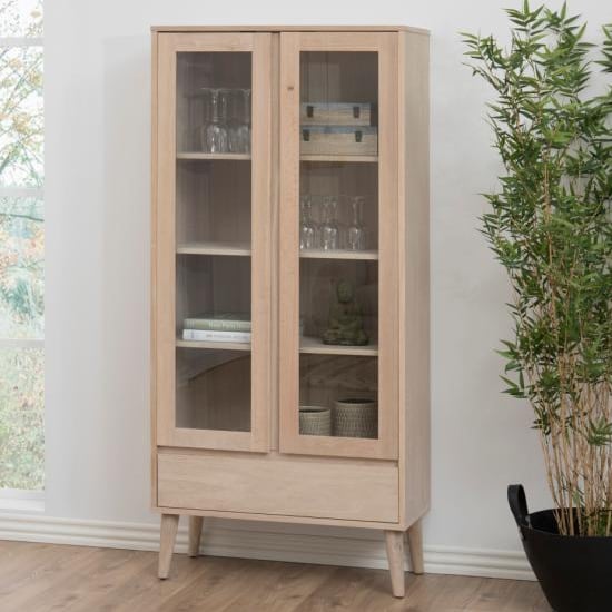 Read more about Nephi wooden 2 doors and 1 drawer display cabinet in white oak
