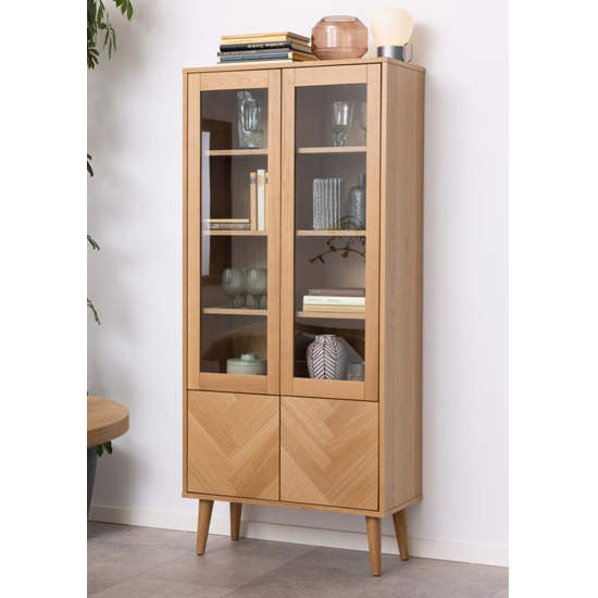 Read more about Nephi wooden 4 doors display cabinet in herringbone oak