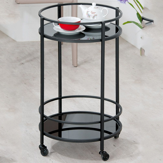 Read more about Newkirk glass serving trolley round with metal frame in black