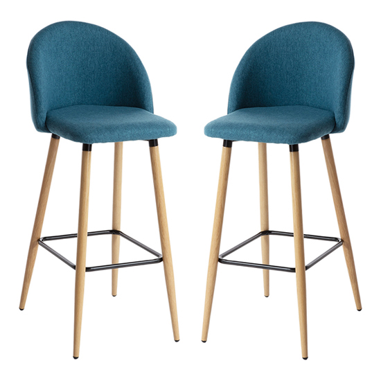 Read more about Nissan blue fabric bar stools with wooden legs in pair