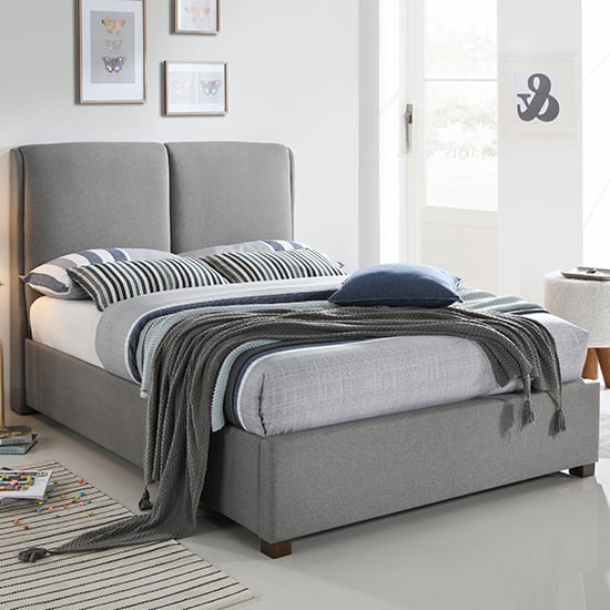 Photo of Oakland fabric double bed in light grey with dark oak legs
