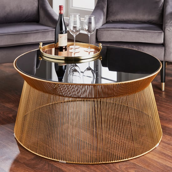 Read more about Ogden curve black glass coffee table with gold wire base