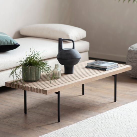 Photo of Okonma wooden coffee table with metal legs in oak