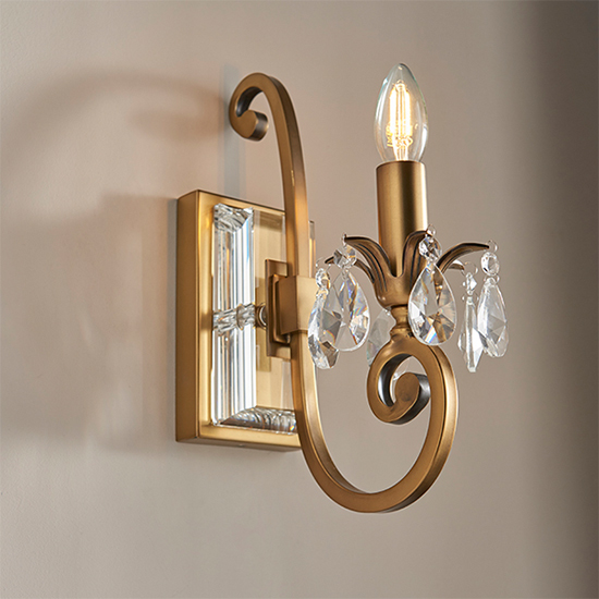 Read more about Oksana single clear crystal wall light in antique brass