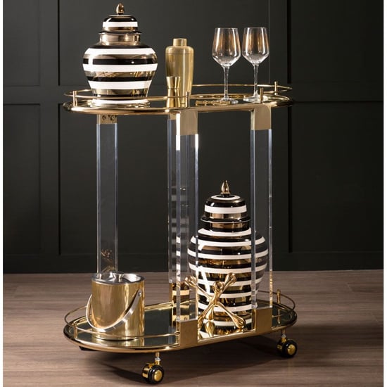 Photo of Orizone oval clear glass top drinks trolley with gold frame