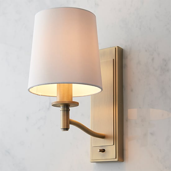 Photo of Ortona 1 light white fabric wall light in matt antique brass