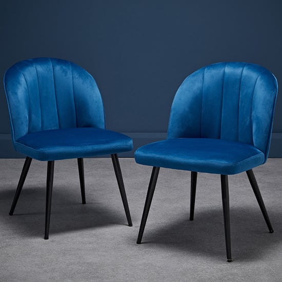 Photo of Orzo blue velvet dining chairs with black legs in pair