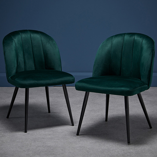 Read more about Orzo green velvet dining chairs with black legs in pair
