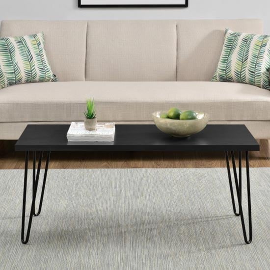 Read more about Ojai wooden coffee table with black legs in black oak