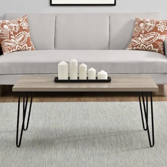 Read more about Ojai wooden coffee table with black legs in rustic oak