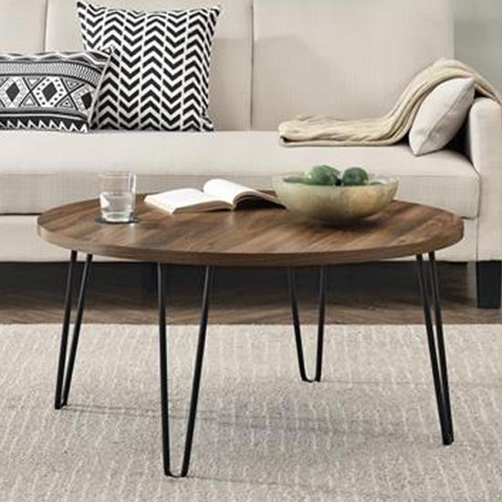 Read more about Ojai wooden round coffee table with black legs in florence walnut