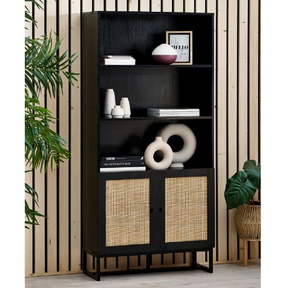 Read more about Pabla wooden bookcase with 2 doors in rattan and black