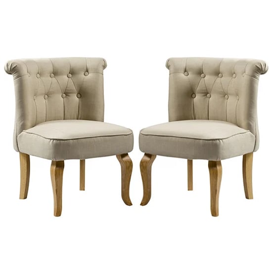 Photo of Pacari beige fabric dining chairs with wooden legs in pair