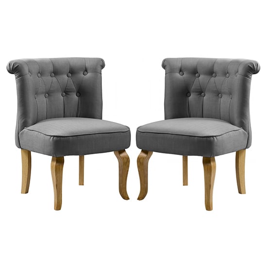 Photo of Pacari grey fabric dining chairs with wooden legs in pair
