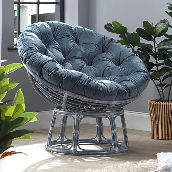 Photo of Palhoca rattan accent chair in grey with velvet blue cushion