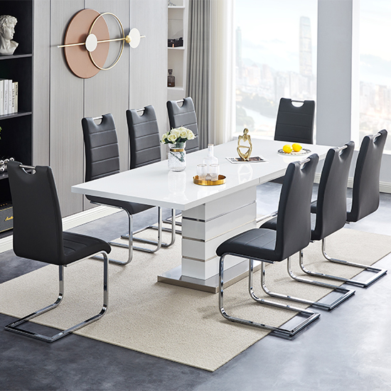 Photo of Parini extendable high gloss dining table 8 petra black chairs