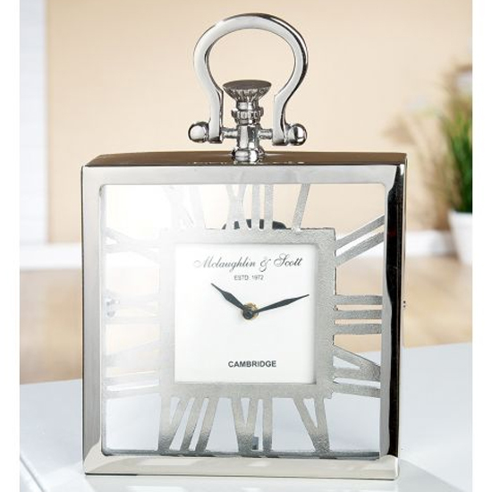 Read more about Pasio glass table clock with silver metal frame