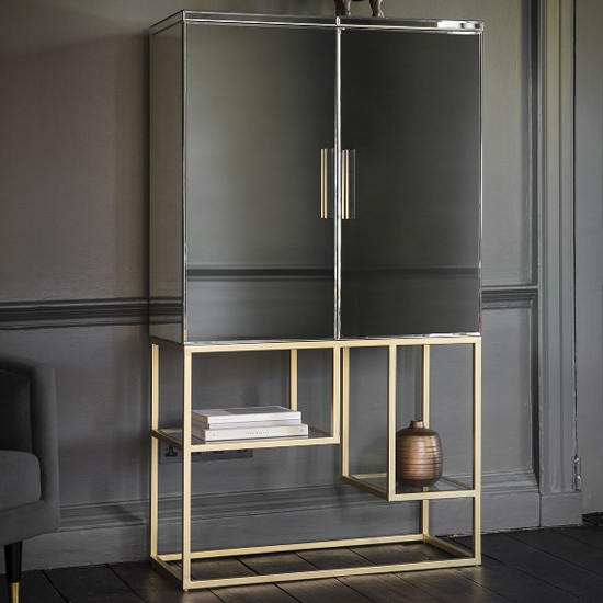 Read more about Petard mirrored bar cabinet with champagne metal frame