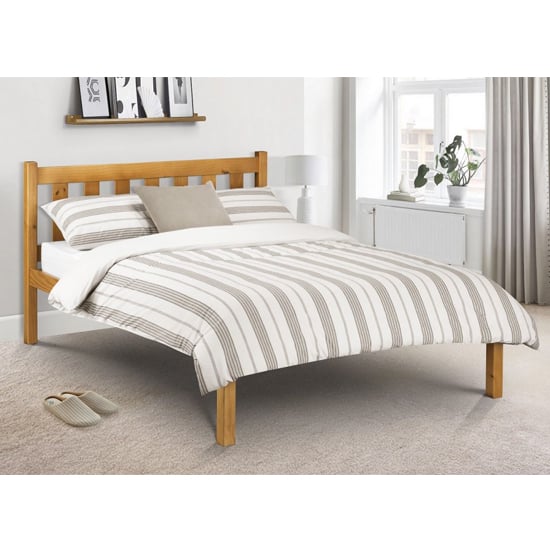 Photo of Paquita solid pine double bed in low sheen lacquer