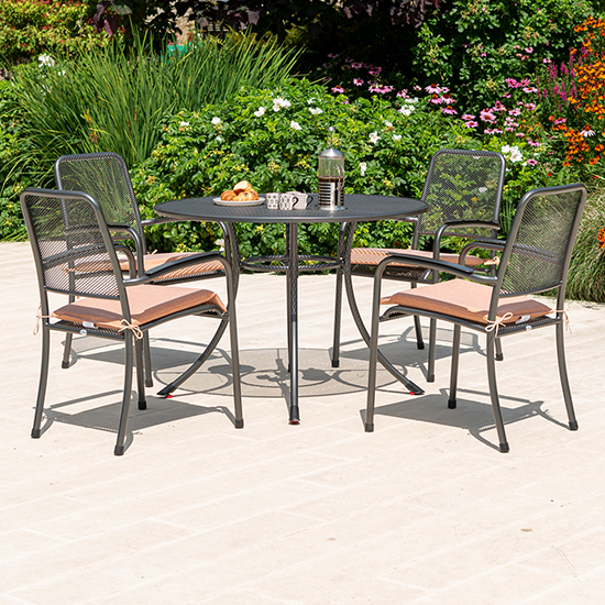 Read more about Prats outdoor 1050mm dining table with 4 armchairs in ochre