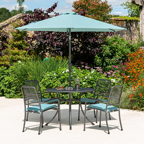Product photograph of Prats Outdoor Dining Table With 4 Chairs And Parasol In Jade from Furniture in Fashion