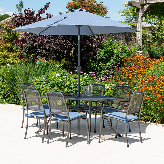 Product photograph of Prats Outdoor Dining Table With 6 Chairs And Parasol In Blue from Furniture in Fashion